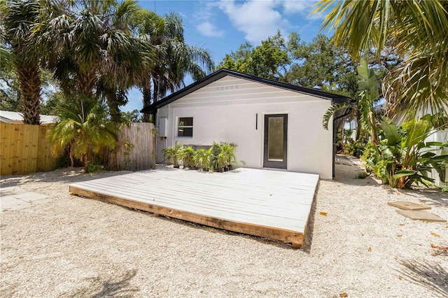 2410 Floyd St, Sarasota, FL 34239 - rear view of property with a wooden deck and stucco siding