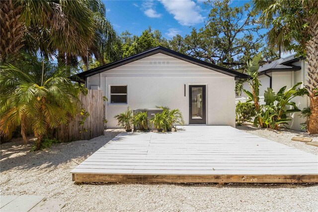 2410 Floyd St, Sarasota, FL 34239 - back of property with a wooden deck and stucco siding