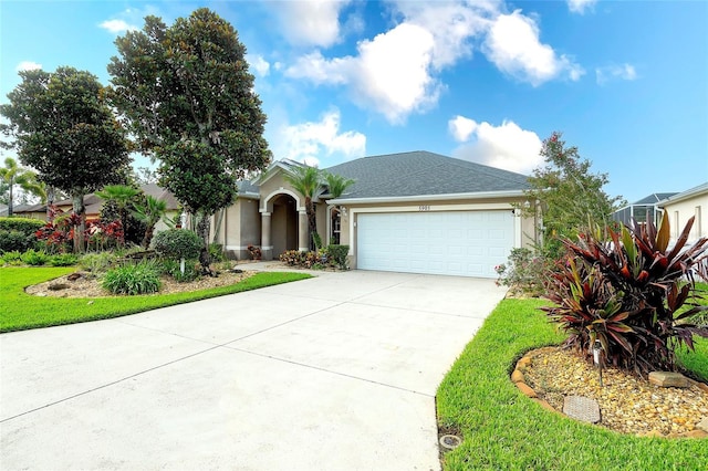 5905 32nd St E, Ellenton, FL 34222 - view of front of home with a garage, driveway, and stucco siding