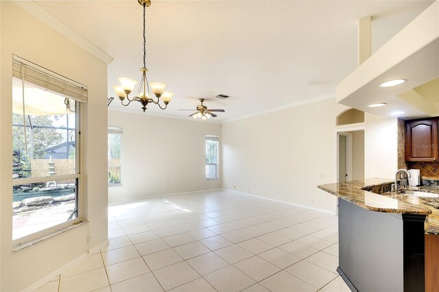 5905 32nd St E, Ellenton, FL 34222 - unfurnished dining area with crown molding, light tile patterned flooring, a ceiling fan, and a chandelier