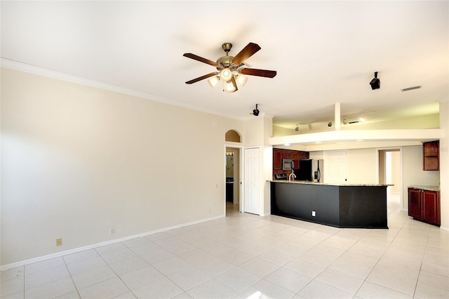 5905 32nd St E, Ellenton, FL 34222 - unfurnished living room featuring a ceiling fan, crown molding, light tile patterned flooring, and arched walkways