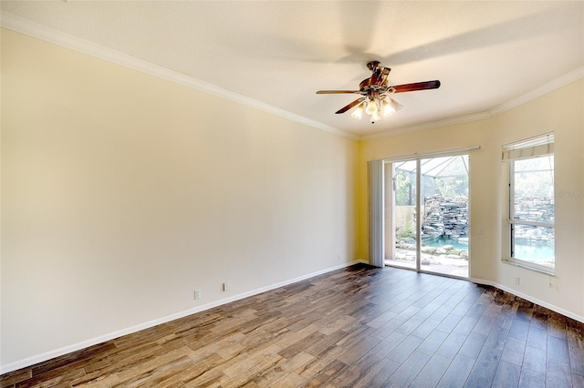 5905 32nd St E, Ellenton, FL 34222 - spare room featuring ceiling fan, dark wood-type flooring, and ornamental molding