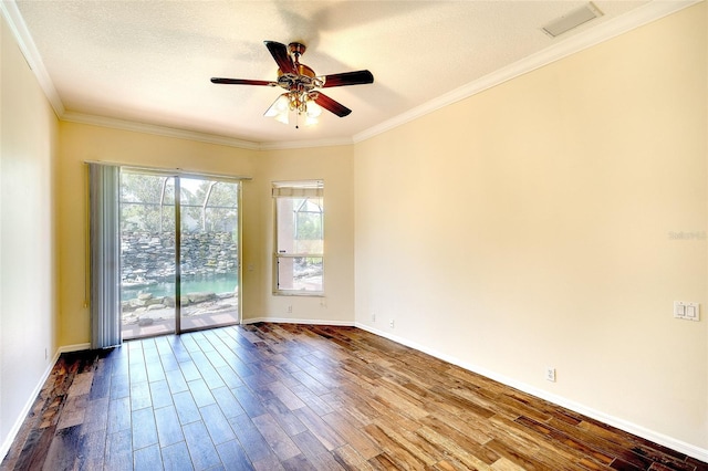 5905 32nd St E, Ellenton, FL 34222 - unfurnished room featuring a ceiling fan, dark wood-style flooring, ornamental molding, and a textured ceiling