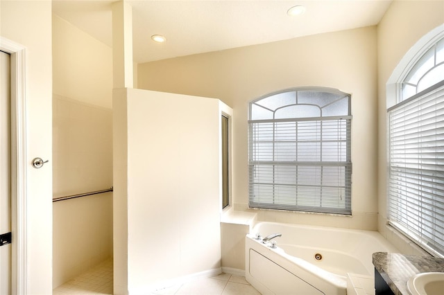 5905 32nd St E, Ellenton, FL 34222 - bathroom featuring a tub with jets, walk in shower, and tile patterned flooring