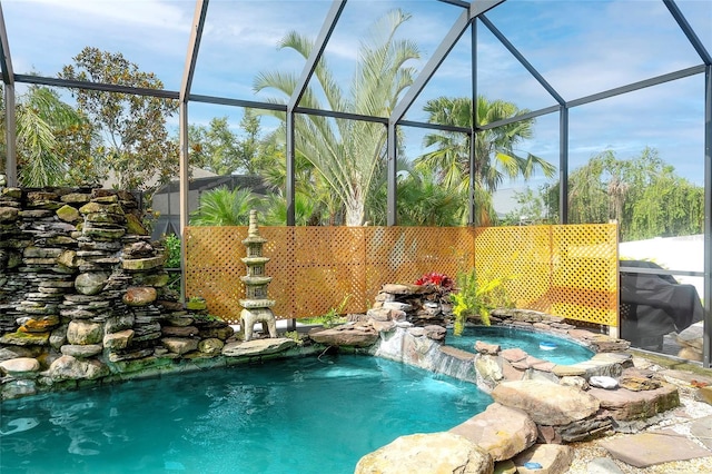 5905 32nd St E, Ellenton, FL 34222 - view of pool with an in-ground hot tub and glass enclosure