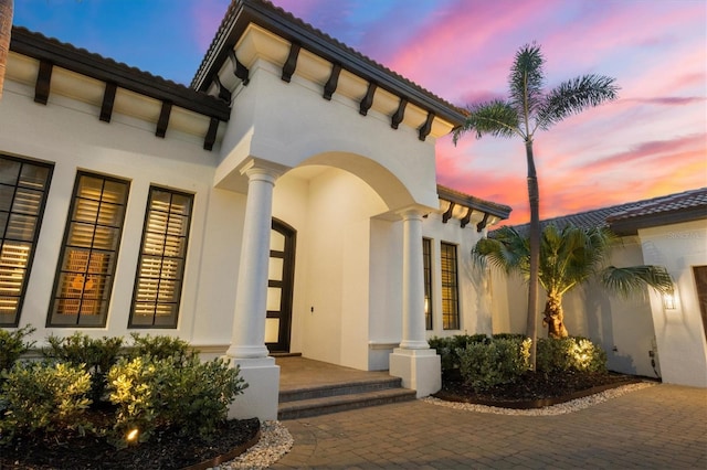 8312 Catamaran Cir, Lakewood Ranch, FL 34202 - doorway to property with stucco siding and a tiled roof