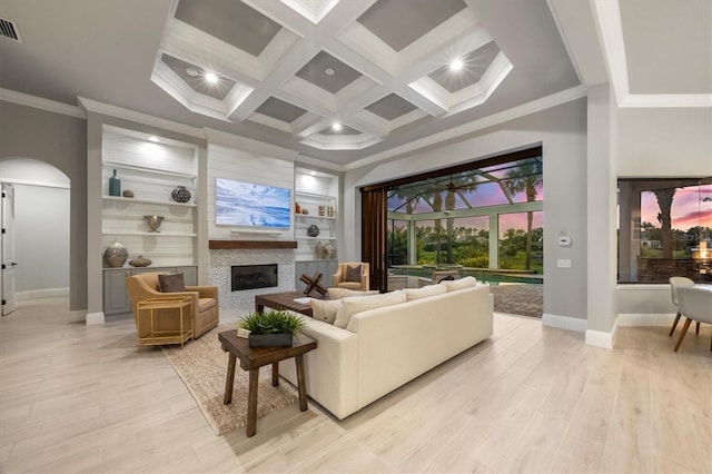 8312 Catamaran Cir, Lakewood Ranch, FL 34202 - living room with baseboards, ornamental molding, light wood-style flooring, a fireplace, and beam ceiling