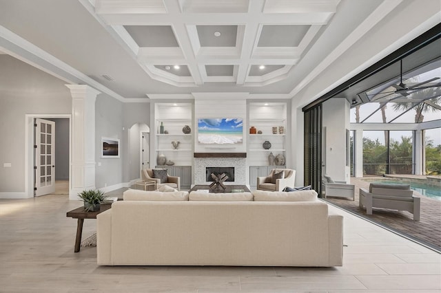8312 Catamaran Cir, Lakewood Ranch, FL 34202 - living room featuring a fireplace, baseboards, ornamental molding, beamed ceiling, and coffered ceiling