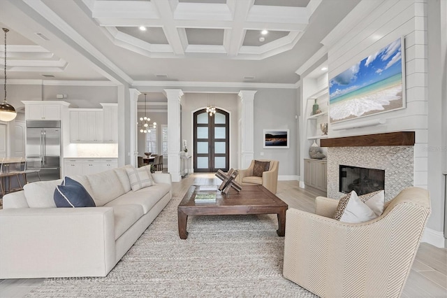 8312 Catamaran Cir, Lakewood Ranch, FL 34202 - living area with a chandelier, a tile fireplace, coffered ceiling, crown molding, and recessed lighting