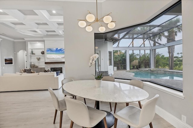 8312 Catamaran Cir, Lakewood Ranch, FL 34202 - dining space featuring beamed ceiling, built in features, baseboards, recessed lighting, and coffered ceiling