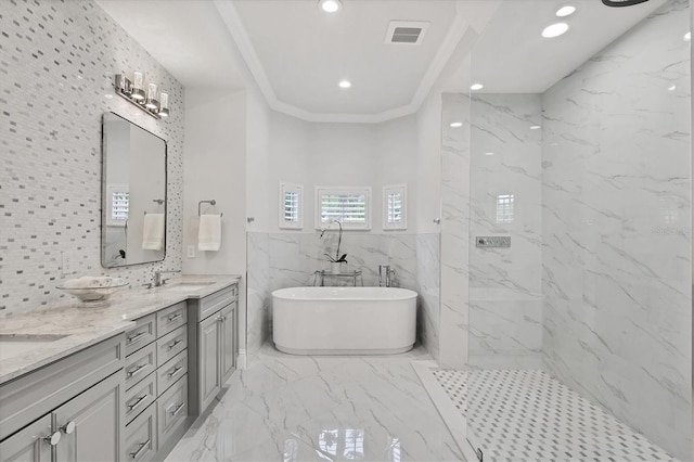 8312 Catamaran Cir, Lakewood Ranch, FL 34202 - bathroom featuring double vanity, marble finish floors, a soaking tub, a marble finish shower, and recessed lighting