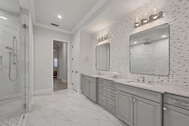8312 Catamaran Cir, Lakewood Ranch, FL 34202 - ensuite bathroom featuring a marble finish shower, double vanity, crown molding, marble finish flooring, and baseboards