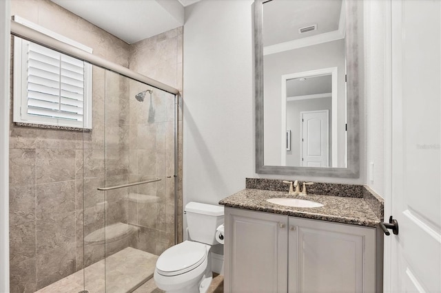 8312 Catamaran Cir, Lakewood Ranch, FL 34202 - full bath with ornamental molding, toilet, vanity, and a stall shower