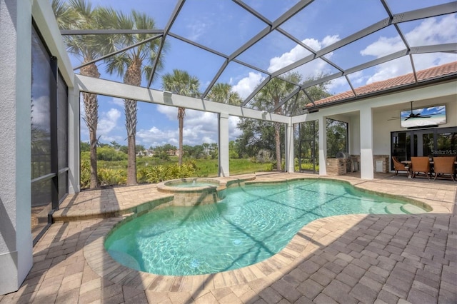 8312 Catamaran Cir, Lakewood Ranch, FL 34202 - view of pool featuring a patio area, a pool with connected hot tub, ceiling fan, and glass enclosure