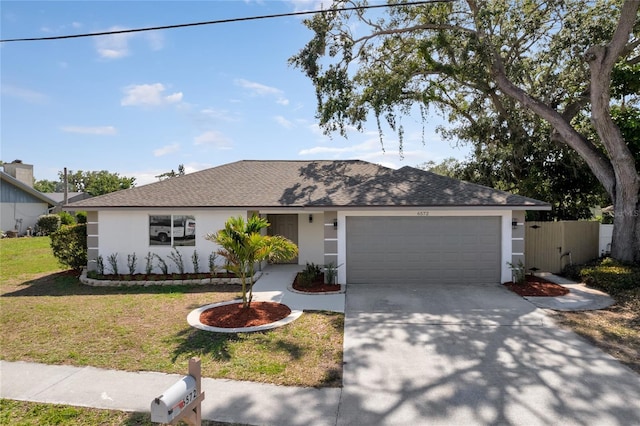 6572 Mauna Loa Blvd, Sarasota, FL 34241 - ranch-style home with a garage, stucco siding, concrete driveway, and a shingled roof