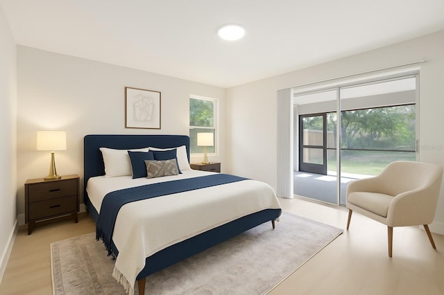 6572 Mauna Loa Blvd, Sarasota, FL 34241 - bedroom with access to outside and light wood-style floors