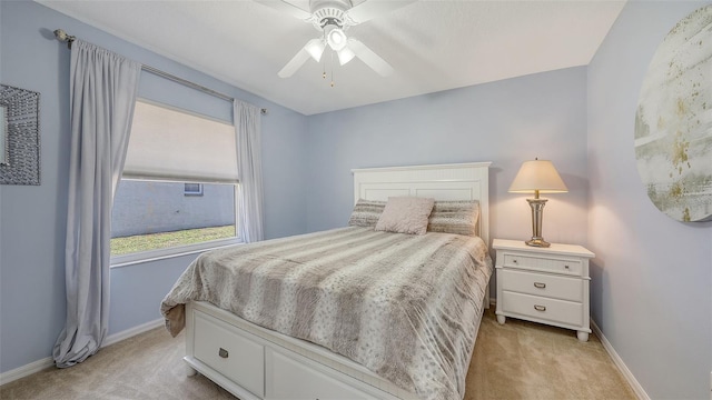 5698 Country Walk Ln, Sarasota, FL 34233 - bedroom with light carpet, baseboards, and a ceiling fan
