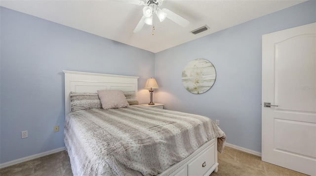 5698 Country Walk Ln, Sarasota, FL 34233 - bedroom with light carpet, baseboards, and a ceiling fan