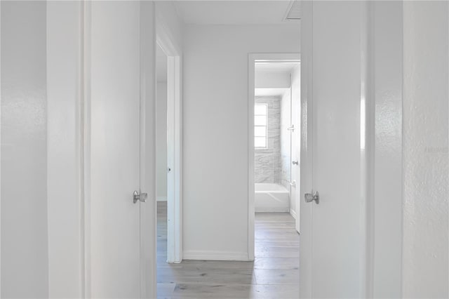 478 Orange Dr NW, Port Charlotte, FL 33952 - hall featuring wood finished floors and baseboards