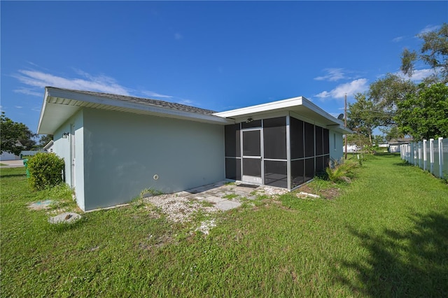 478 Orange Dr NW, Port Charlotte, FL 33952 - back of property with a sunroom and stucco siding