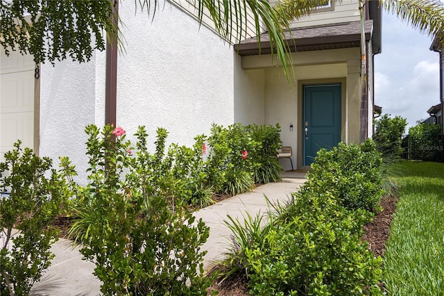 9148 Royal River Cir, Parrish, FL 34219 - doorway to property with stucco siding