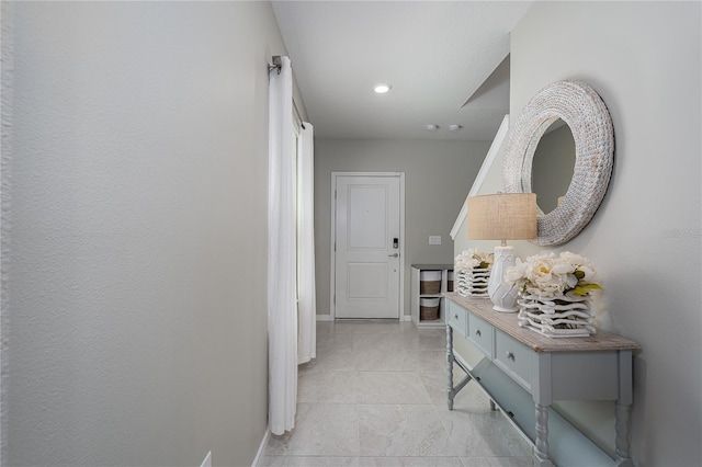 9148 Royal River Cir, Parrish, FL 34219 - corridor with baseboards and light tile patterned floors