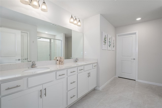9148 Royal River Cir, Parrish, FL 34219 - bathroom featuring double vanity, a shower stall, and baseboards