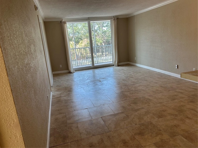 2650 Coconut Bay Ln Unit 521, Sarasota, FL 34237 - unfurnished room featuring a textured wall, ornamental molding, a textured ceiling, and baseboards