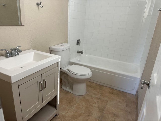 2650 Coconut Bay Ln Unit 521, Sarasota, FL 34237 - bathroom featuring toilet, vanity, shower / washtub combination, and a textured wall