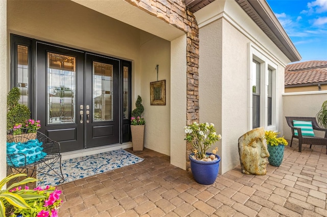 5011 Tivoli Run, Bradenton, FL 34211 - property entrance with french doors, stucco siding, and stone siding