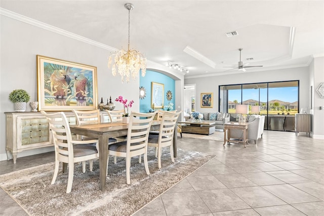 5011 Tivoli Run, Bradenton, FL 34211 - dining area featuring ornamental molding, ceiling fan, a chandelier, light tile patterned floors, and a tray ceiling