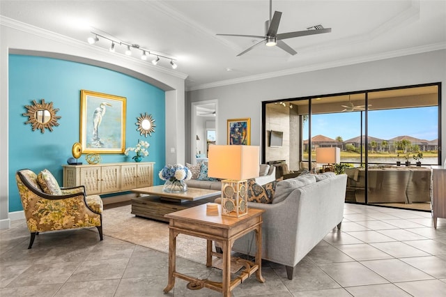5011 Tivoli Run, Bradenton, FL 34211 - living room featuring crown molding, ceiling fan, and tile patterned flooring