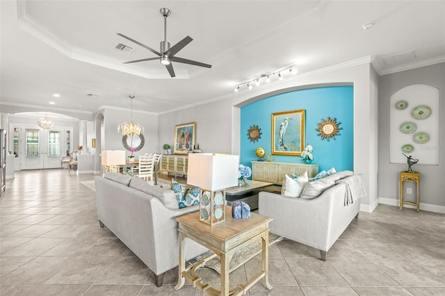 5011 Tivoli Run, Bradenton, FL 34211 - living room with arched walkways, a chandelier, a ceiling fan, light tile patterned flooring, and ornamental molding