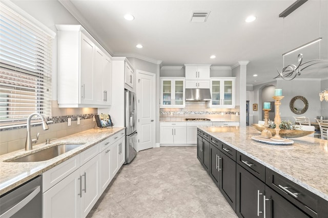 5011 Tivoli Run, Bradenton, FL 34211 - kitchen featuring a sink, stainless steel appliances, dark cabinetry, white cabinetry, and under cabinet range hood