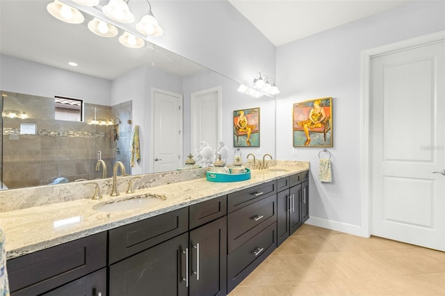 5011 Tivoli Run, Bradenton, FL 34211 - bathroom featuring double vanity, tile patterned floors, baseboards, and a tile shower
