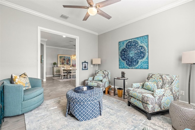 5011 Tivoli Run, Bradenton, FL 34211 - living room with wood finished floors, crown molding, ceiling fan, and baseboards