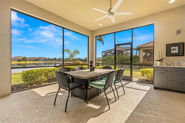 5011 Tivoli Run, Bradenton, FL 34211 - sunroom featuring a ceiling fan, a water view, and outdoor dining area