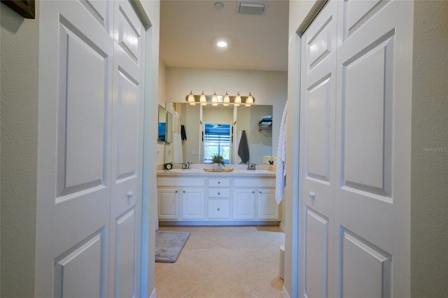 7155 Boca Grove Pl Unit 202, Lakewood Ranch, FL 34202 - bathroom with double vanity, a closet, and tile patterned floors