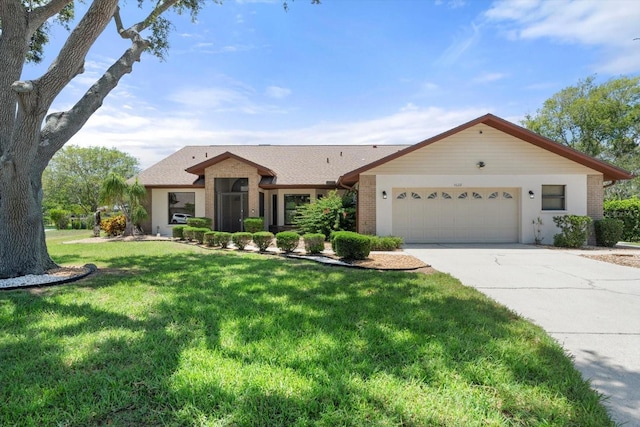 4622 34th Ct E, Bradenton, FL 34203 - ranch-style home with a garage, concrete driveway, brick siding, and a front lawn