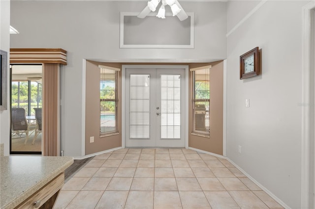 4622 34th Ct E, Bradenton, FL 34203 - foyer entrance with french doors, light tile patterned flooring, baseboards, and ceiling fan