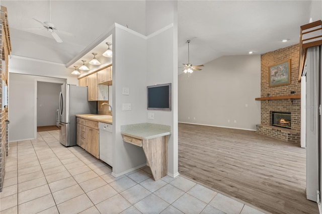 4622 34th Ct E, Bradenton, FL 34203 - kitchen featuring a ceiling fan, white dishwasher, light countertops, high vaulted ceiling, and freestanding refrigerator