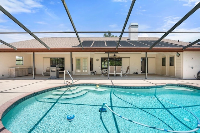 4622 34th Ct E, Bradenton, FL 34203 - swimming pool with french doors, glass enclosure, a patio, and a ceiling fan