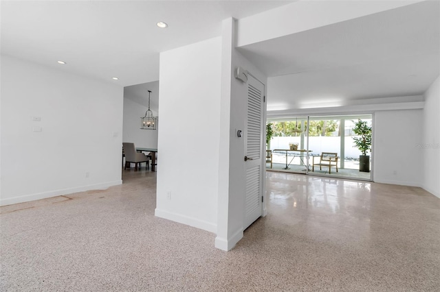 130 N Adams Dr, Sarasota, FL 34236 - empty room featuring speckled floor, baseboards, a chandelier, and recessed lighting