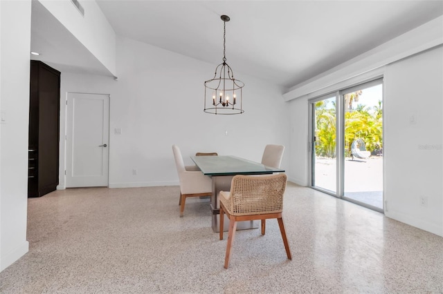 130 N Adams Dr, Sarasota, FL 34236 - dining area featuring vaulted ceiling, dark speckled floor, baseboards, and a chandelier