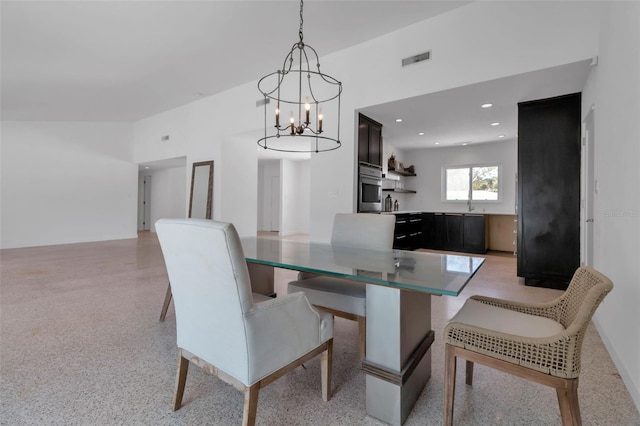 130 N Adams Dr, Sarasota, FL 34236 - dining space with a chandelier, dark speckled floor, and recessed lighting