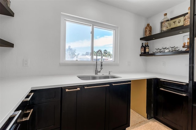 130 N Adams Dr, Sarasota, FL 34236 - kitchen featuring a sink, open shelves, dark speckled floor, and dark cabinetry