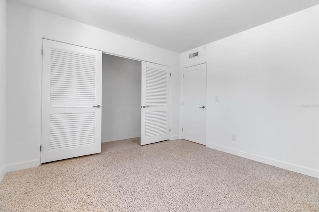 130 N Adams Dr, Sarasota, FL 34236 - unfurnished bedroom featuring baseboards and a closet