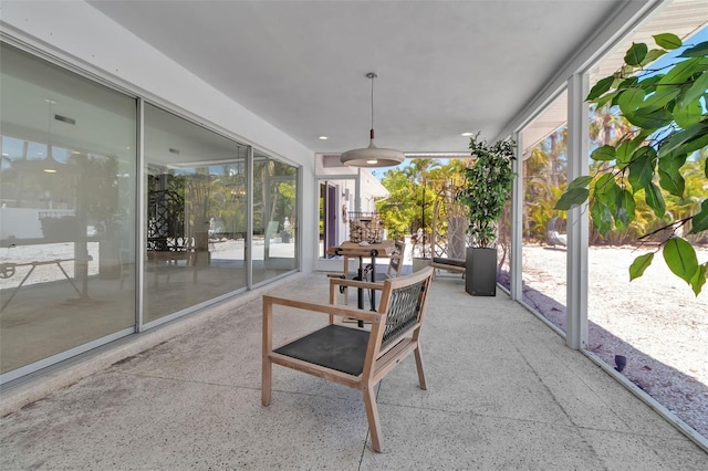 130 N Adams Dr, Sarasota, FL 34236 - sunroom / solarium featuring speckle patterned floor and a ceiling fan