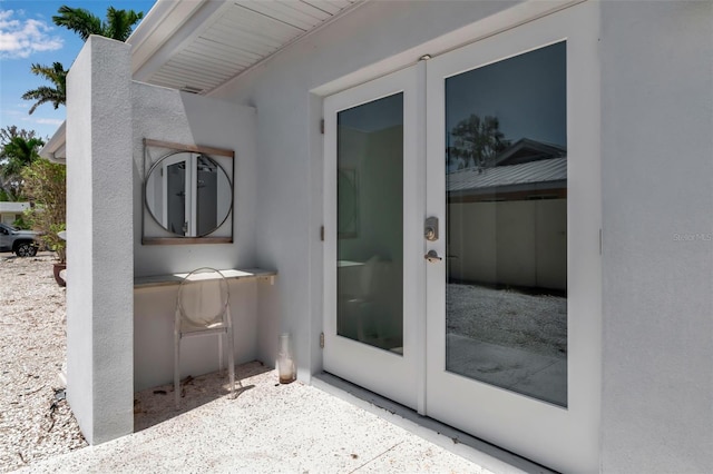 130 N Adams Dr, Sarasota, FL 34236 - entrance to property with stucco siding and french doors