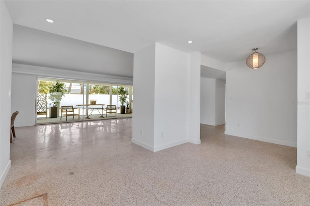 130 N Adams Dr, Sarasota, FL 34236 - unfurnished room featuring speckle patterned floor, baseboards, and recessed lighting